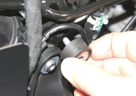 Install and hand tighten rubber isolator into threaded hole.